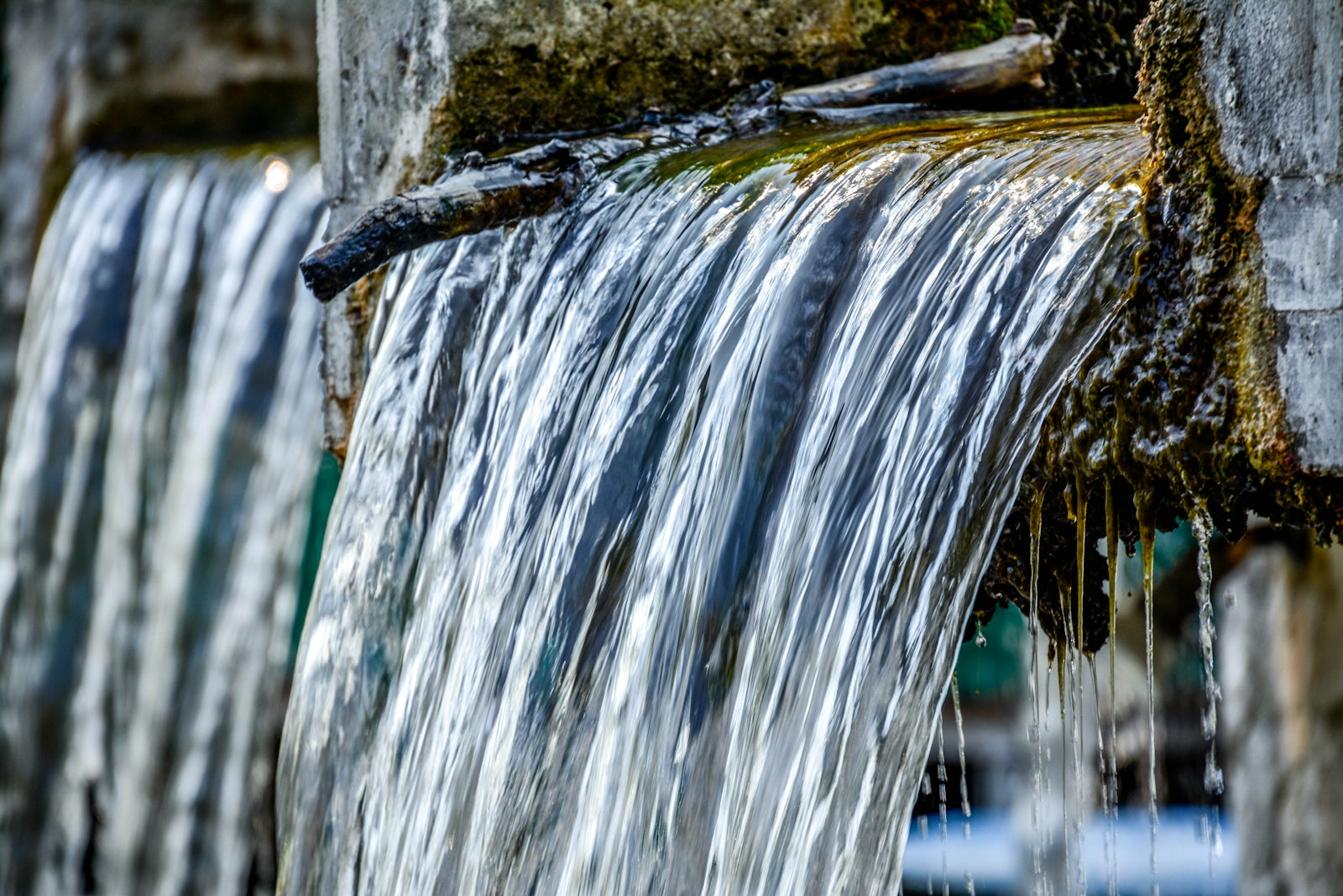 a waterfall with water falling