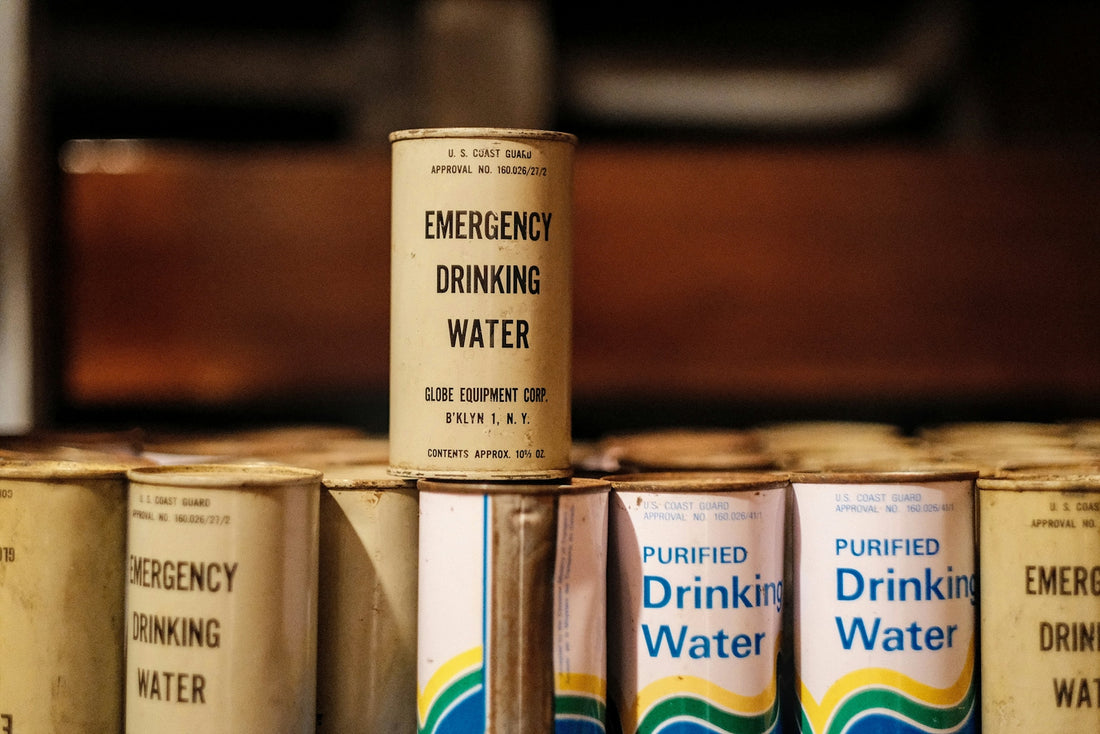 Several cans of drinking water stacked on top of each other